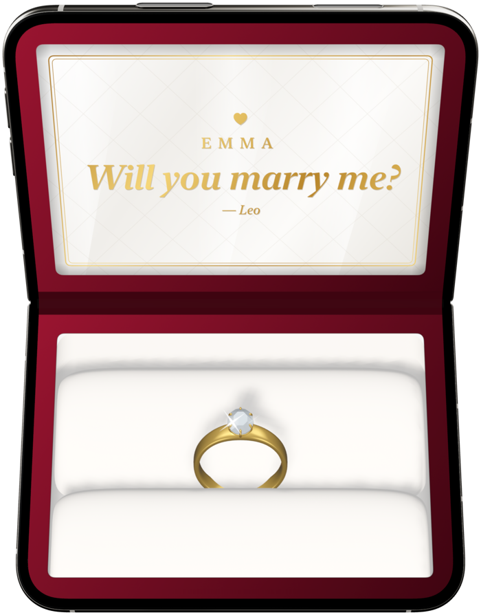 A red velvet ring box open on a folding phone: “Emma, will you marry me?” in gold in the lid, and a gold ring with a diamond in the cushion